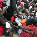 Residents Desperate For A Planned Distribution Of Food For Those Suffering Under Kenya's Coronavirus Related Movement Restrictions Push Through A Gate And Create A Stampede,