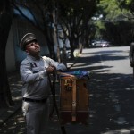 Sergio Munoz Turns The Crank On A Traditional Organ