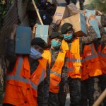 Soldiers Carry Boxes With Food To Deliver To The Poor At The Santa Rosita Neighborhood On The Outskirts Of Guatemala City
