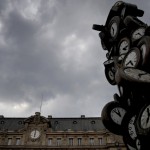 The Saint Lazare Train Station Clock, Left, And The Sculpture Named 