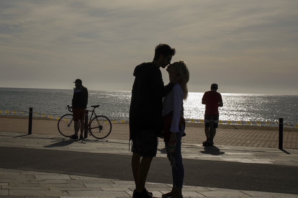 A Couble Kiss In Front Of The Sea In Barcelona, Spain, Saturday, May 2,
