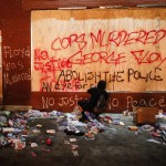 A Protestor Sprays Graffiti On A Wall Near The Minneapolis 3rd Police Precinct, Thursday, May 28