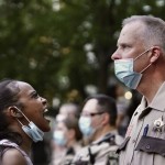A Woman Yells At A Sheriff's Deputy During A Protest Following The Death Of George Floyd At The Hand Of Minneapolis Police Officers