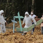 Funeral Workers In Protective Gear Prepare A Grave At The Nossa Senhora Aparecida Cemetery, For A Woman Who Is Suspected To Have Died Of Covid 19 In Manaus, Amazonas State Brazil
