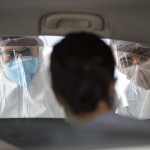 In This Monday, March 30, 2020 Photo, Medical Personnel Interview Commuters, Checking To See If They Have Symptoms Of The Novel Cornavirus, In Guarulhos, On The Outskirts Of Sao Paulo, Brazil