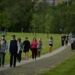 People Wearing Face Masks To Protect Against Coronavirus Exercise Along Vuelta Del Castillo Park, In Pamplona