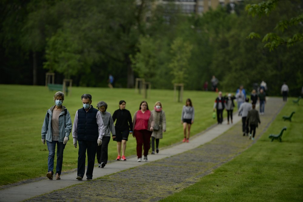 People Wearing Face Masks To Protect Against Coronavirus Exercise Along Vuelta Del Castillo Park, In Pamplona