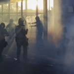 Police Move Through An Area During Demonstrations Thursday, May 28
