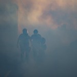 Police Officers Walk Through A Cloud Of Tear Gas, Thursday, May 28