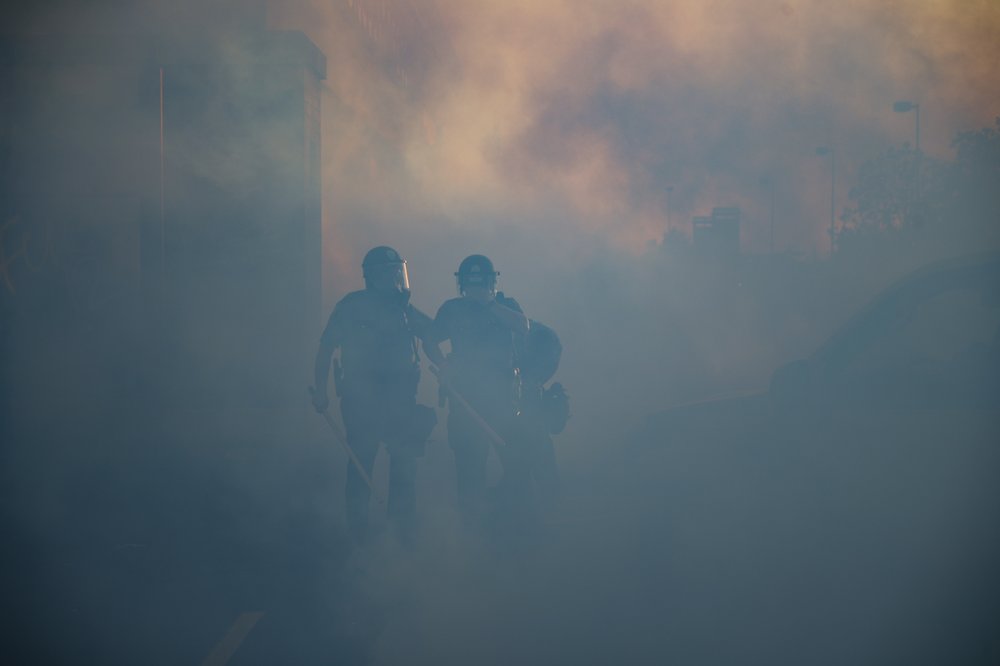 Police Officers Walk Through A Cloud Of Tear Gas, Thursday, May 28