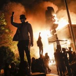 Protestors Demonstrate Outside Of A Burning Fast Food Restaurant, Friday, May 29