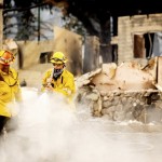 A Los Angeles County Firefighter Extinguishes Hot Spots At A Scorched Residence While Battling The Lake Fire In The Angeles National Forest, Calif.,