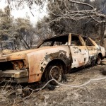 A Burned Vehicle Rests Along Pine Canyon Rd. As The Lake Fire Burns In The Angeles National Forest, Calif., North Of Santa Clarita On Thursday, Aug. 13, 2020