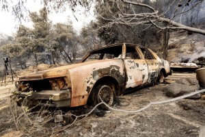 A Burned Vehicle Rests Along Pine Canyon Rd. As The Lake Fire Burns In The Angeles National Forest, Calif., North Of Santa Clarita On Thursday, Aug. 13, 2020