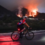 A Cyclist Rides Along A Trail As The Ranch Fire Burns, Thursday, Aug. 13, 2020, In Azusa, Calif
