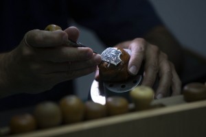A Worker For The Israeli Jewelry Company Yvel Holds A Part Of A Mask In Motza Near Jerusalem