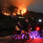 Cyclists Rest Along A Trail As The Ranch Fire Burns, Thursday, Aug. 13, 2020, In Azusa, Calif