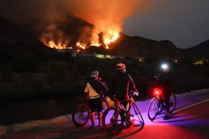 Cyclists Rest Along A Trail As The Ranch Fire Burns, Thursday, Aug. 13, 2020, In Azusa, Calif