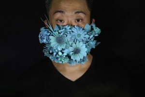 Edmond Kok, A Hong Kong Theater Costume Designer And Actor, Wearing A Face Mask Covered In Blue Artificial Flowers Which He Made On Valentine's Day This February In Hong Kong