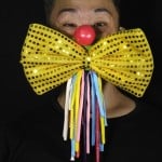 Edmond Kok, A Hong Kong Theater Costume Designer And Actor, Wearing A Face Mask Designed As Traditional Clown Face And Bow Tie Costume In Hong Kong