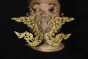 Edmond Kok, A Hong Kong Theater Costume Designer And Actor, Wearing A Face Mask Inspired By The Decoration Of Thai Temple To Kok's Face In Hong Kong