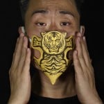 Edmond Kok, A Hong Kong Theater Costume Designer And Actor, Wearing A Face Mask Made By A Paper Tiger Use For Villain Hitting In Hong Kong