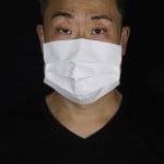 Edmond Kok, A Hong Kong Theater Costume Designer And Actor, Wearing A Face Mask Made By A White Paper In Hong Kong