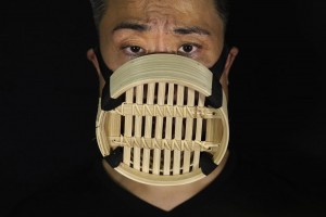 Edmond Kok, A Hong Kong Theater Costume Designer And Actor, Wearing A Face Mask Made From Chinese Bamboo Steamer In Hong Kong