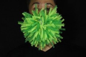 Edmond Kok, A Hong Kong Theater Costume Designer And Actor, Wearing A Spiky Green Mask Which Is A 3d Visualisation Of Corona Virus In Hong Kong