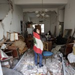 Farah Mahmoud, Wrapped In Lebanese National Flag, Checks Her Parents Destroyed Apartment After Tuesday's Explosion