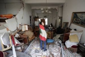Farah Mahmoud, Wrapped In Lebanese National Flag, Checks Her Parents Destroyed Apartment After Tuesday's Explosion
