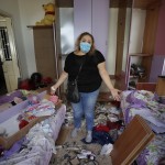 Mona Al Chami, Poses For A Photograph Inside Her Destroyed Apartment After Tuesday's Explosion