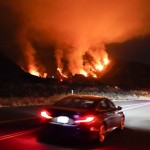 Motorists Make Their Way Along A Road As The Ranch Fire Burns, Thursday, Aug. 13, 2020, In Azusa, Calif.