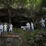 Researchers Putting On Ppe Suits And Standing In Front Of Cave Prepare Catch Bat Inside Sai Yok National Park In Kanchanaburi Province