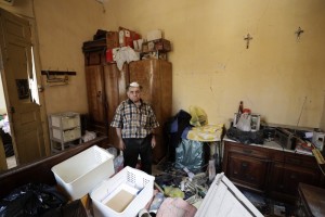 Waleed Mokbel, 78, Poses For A Photograph Inside His Destroyed Apartment After Tuesday's Explosion