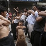 A Shiite Muslim Boy Beat His Chest With Others During A Muharram Procession, In Lahore, Pakistan