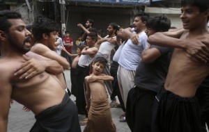 A Shiite Muslim Boy Beat His Chest With Others During A Muharram Procession, In Lahore, Pakistan
