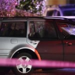 A Car With Shattered Windows And Likely Bullet Holes Stands In The Area Where A Man Suspected Of Fatally Shooting A Supporter Of A Right Wing Group In Portland, Ore.