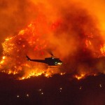 A Helicopter Prepares To Drop Water At A Wildfire In Yucaipa, Calif., Saturday, Sept. 5, 2020