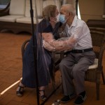 Agustina Cañamero, 81, And Pascual Pérez, 84, Hug And Kiss Through A Plastic Film Screen To Avoid Contracting The Coronavirus At A Nursing Home In Barcelona, Spain