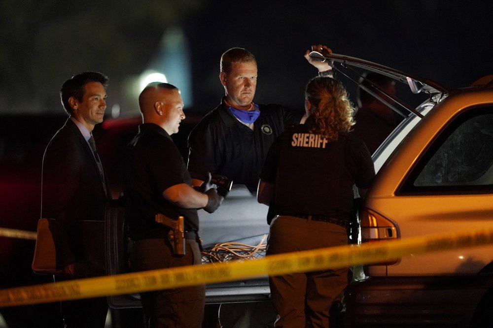 Law Enforcement Officials Search A Vehicle, Thursday