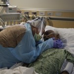 Romelia Navarro, 64, Weeps While Hugging Her Husband, Antonio, In His Final Moments In A Covid 19 Unit At St. Jude Medical Center In Fullerton, Calif