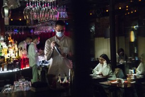 A Bartender Wearing Face Mask To Protect Against Coronavirus Makes A Cocktail At Strelka Bar In Moscow, Russia, Friday, Oct. 23