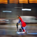 A Man Wearing A Superhero Costume Rides A Scooter In Bucharest, Romania, Friday, Oct. 23