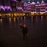 A Passersby Strolls And Takes Photographs On Grand Place During An Autumn Evening Prior To The Curfew In Downtown Brussels, Friday, Oct. 23