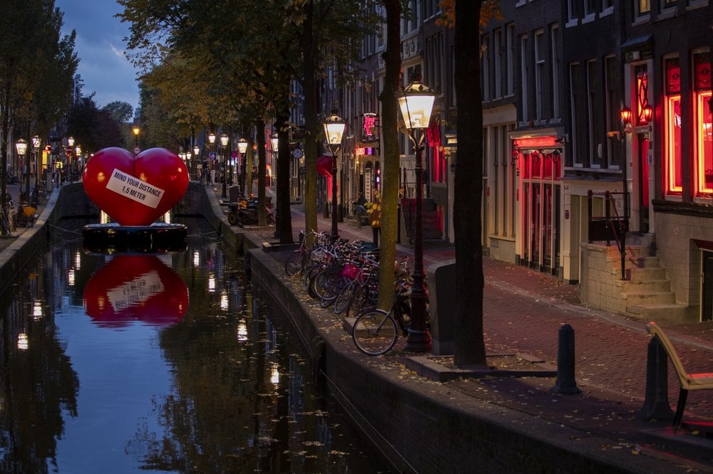 A Red Heart Carries A Social Distancing Message In A Near Empty Red Light District In Amsterdam, Netherlands, Friday, Oct. 23