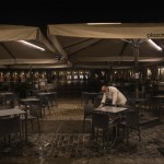 A Waiter Closes The Terrace Of A Bar On The Mayor Square In Downtown Madrid, Spain, Friday, Oct. 23