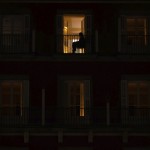 A Woman Sits On The Balcony Of Her Home On The Mayor Square In Downtown Madrid, Spain, Friday, Oct. 23