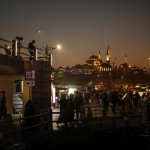 Backdropped By The Suleymaniye Mosque People Stroll Along The Banks Of The Bosporous In Istanbul, Turkey Friday, Oct. 23