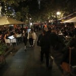 People Walk Along The Street Crowded With Coffee Shops And Clubs Full Of Guests In Downtown Belgrade, Serbia, Friday, Oct. 23